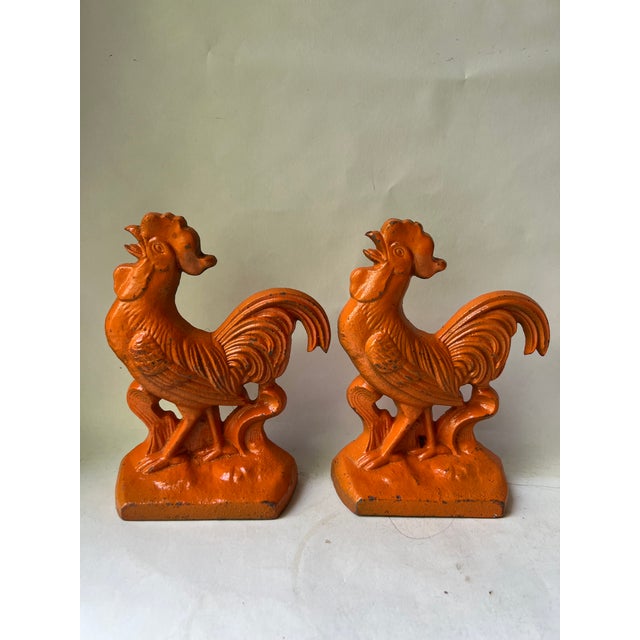 Antique Pair of Orange Painted Metal Cast Iron Roosters Chickens BOOKENDS Very heavy, approximately 63/4” tall 4 1/4” wide...