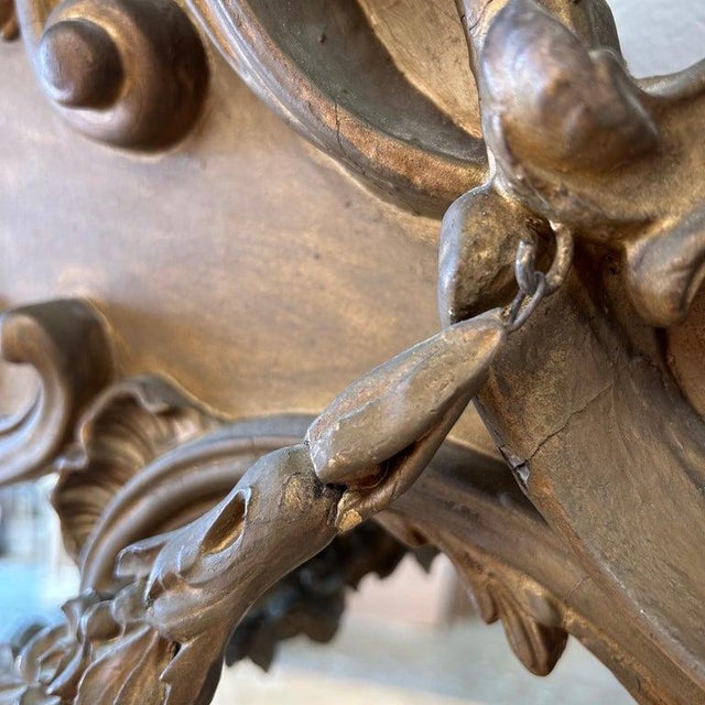 French Rose swag mirror Original gilt wood finish, subtle distressed edges. Carvings are done in wood and gesso. The swag...