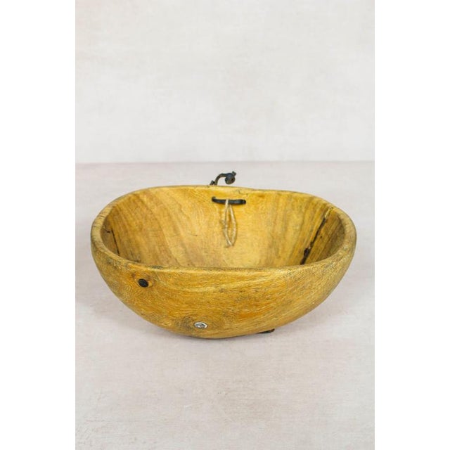 This hand-carved wooden bowl is made by the Turkana, a nomadic community in north-west Kenya prized for their woodcarving...