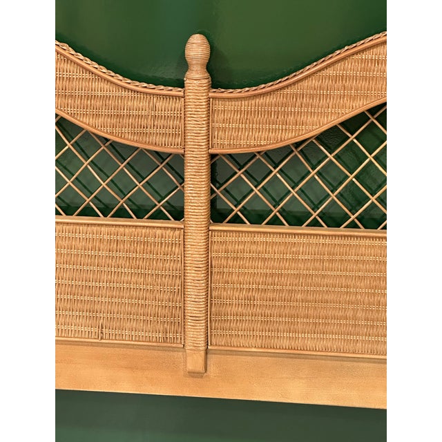 A striking king size woven rattan headboard by Henry Link (unsigned) for Lexington Furniture, featuring an elegant double-...