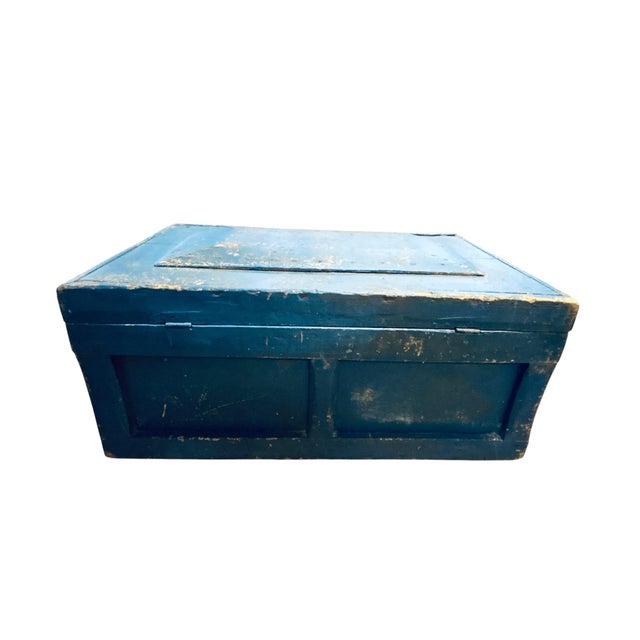 Vintage rustic solid wood trunk with hinged lid and original iron latch. Age has left this beauty with layers of paint...