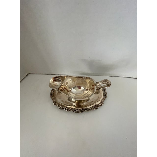 Vintage silverplate gravy boat with attached underplate. I love this piece, no more drips ruining your table or table...