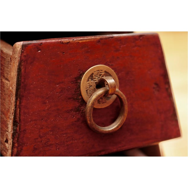 A traditional antique Chinese hand-crafted wooden barber’s stool with original brass fittings, open-top coin slot, three...