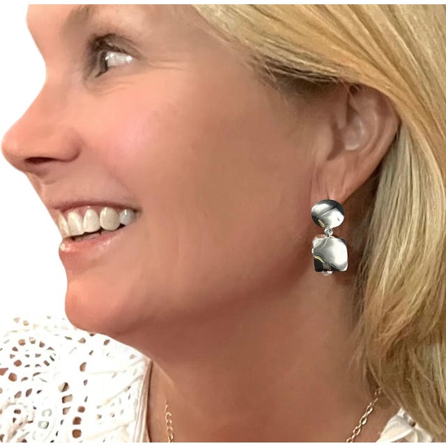 These shiny sterling silver earrings are light as a whisper but pack a big statement. Handmade