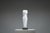 The sculpture stands in quiet authority—an abstract white marble torso, both timeless and deliberately incomplete. Its...