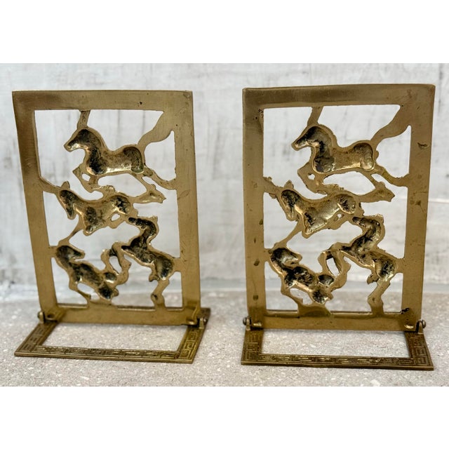 Vintage Chinoiserie Brass Horse Bookends With a Cut-Out Design of Galloping Horses Surrounded by a Greek Key Border-a Pair For Sale - Image 9 of 12