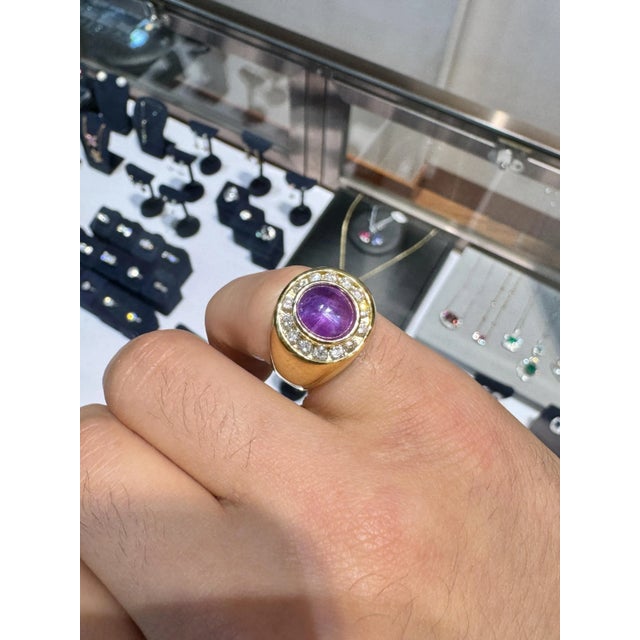 GIA Certified No Heat Pink/Purple Star Sapphire & Diamond Dome Ring. This dome ring features a bezel-set star sapphire...