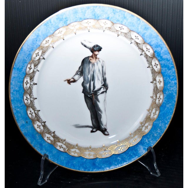 Porcelain polychrome with figure of Pulcinella in well. Rim in marbled blue and gold. Title under the base. Probably...
