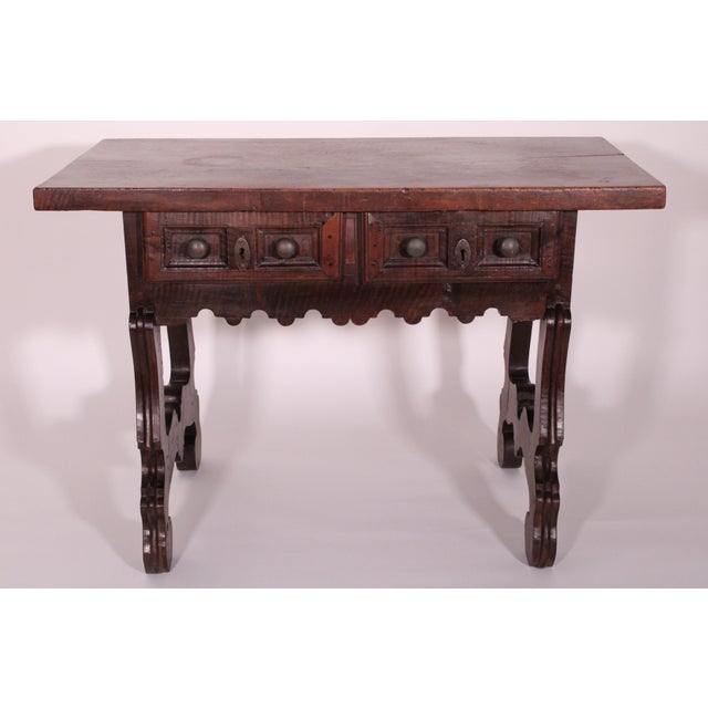 Antique baroque style walnut library table, 18th century. With a 1.75" thick single board top, two frieze drawers with...