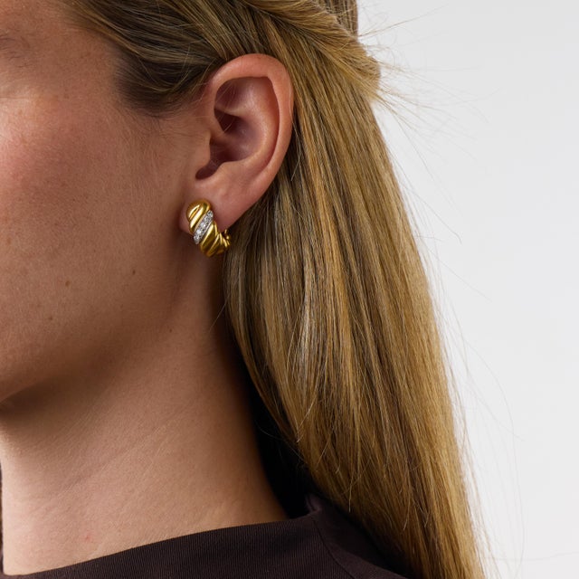 These elegant vintage diamond hoop ear clips are a beautifully polished 1970’s design, set with 12 round brilliant cut...