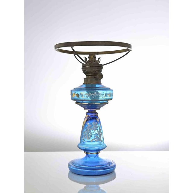 This Antique Blue Glass Kerosene Lamp is a refined design lamp manufactured around 1910. Oil lamp made of blue glass with...
