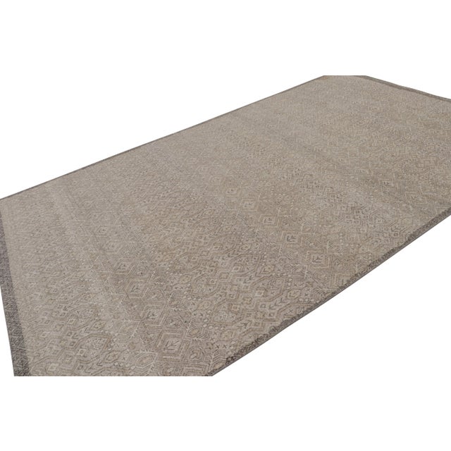 Hand-knotted in wool, this 8x12 contemporary rug as inspired by tribal rug designs in more contemporary colors, is a new...