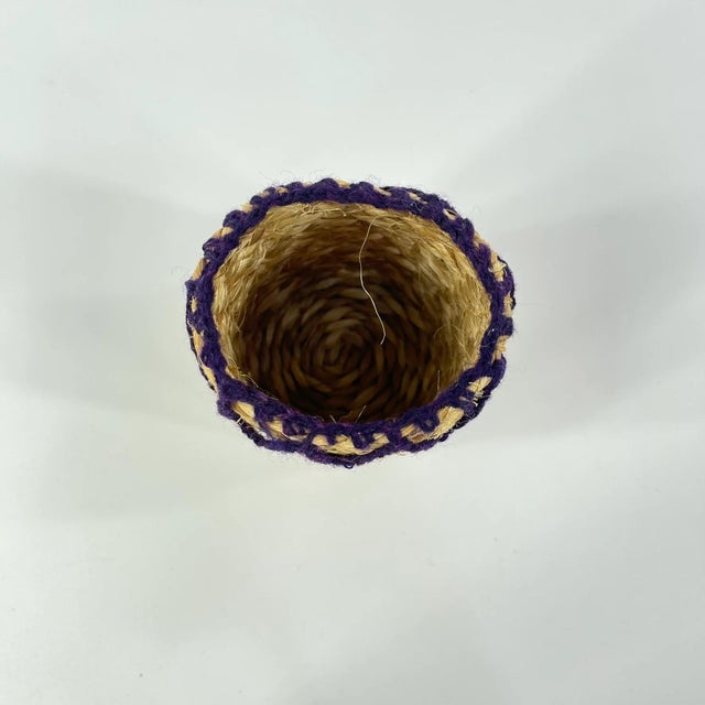A small glass vase could be placed inside this hand-woven sisal vase to hold water and have flowers in it.The Sisal...