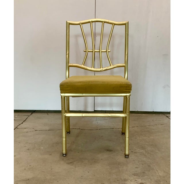 A pair Hollywood Regency Faux Bamboo Gold Banquet Dining Chairs by Shelby Williams Item features steel metal frame, faux...