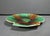 An antique 19th-century Wedgwood majolica scallop-shell shaped plate with mottled green, brown, amber, and cream glaze....