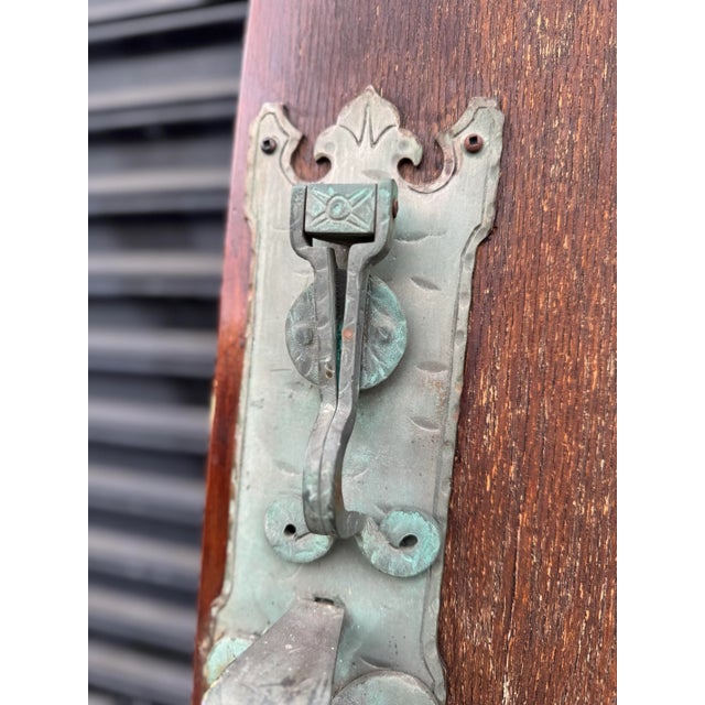 An exceptional architectural salvage piece, this original 1920s door was removed from a distinguished Tudor Revival home...