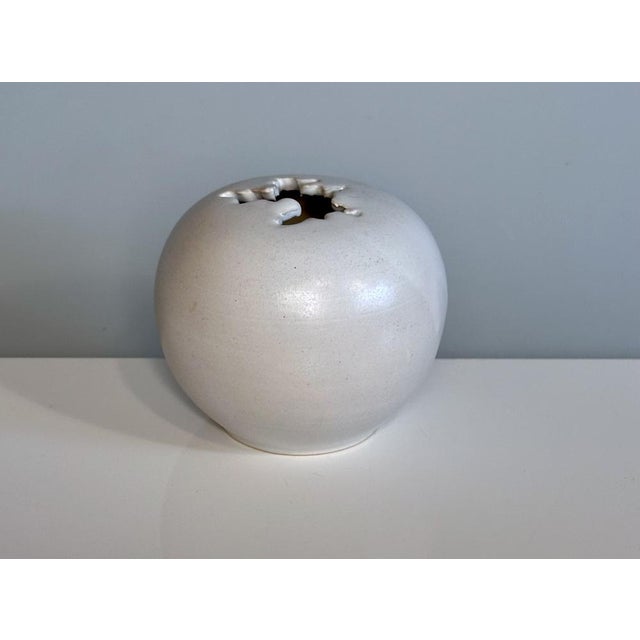 This high quality modernist ball-shaped studio ceramic art vase was handcrafted in West-Germany during the 1960s. The...