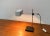 Mid Century table lamp from Max Bankenholz. Here in the version with white umbrella. The lamp is almost identical to the...