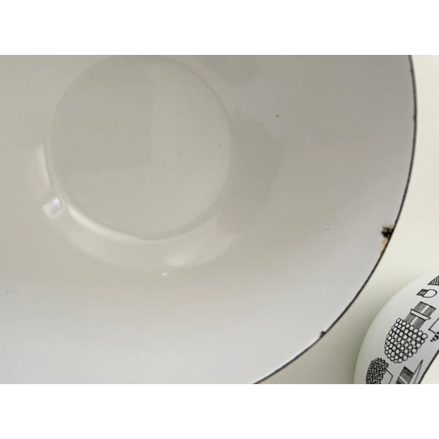 Set of eleven Finel white and black mid century modern enamelware bowls with mushroom motif. One large bowl and ten small...