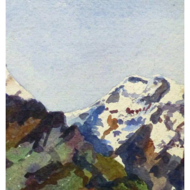 Brightly lit French watercolor of snow capped mountains peeking over lush, green hillsides, circa 1930. Original artwork...