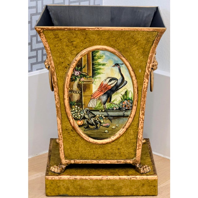 A striking vintage Castilian Imports, Inc. Regency-style tole cachepot or decorative planter, richly finished in olive...