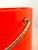A striking 1960s Mid-Century Modern ice bucket by Kraftware of New York, finished in a vivid bright orange with sculptural...