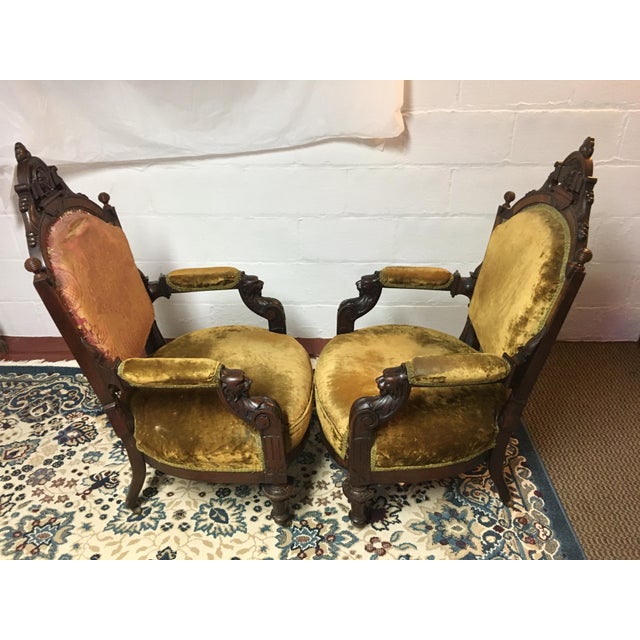 Fabulous Antique Victorian mahogany parlor chair with arms and hand carved figural lion heads on the armrests. These lion...