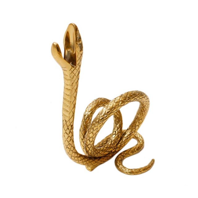 Pair of snake candelabra made of brass. This candleholder is perfect for holding candles at an opulent table setting -...