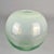 Hand blown heavy weighted ball vase in clear glass over flowing to opaline at the top and green at the bottom by Copier,...
