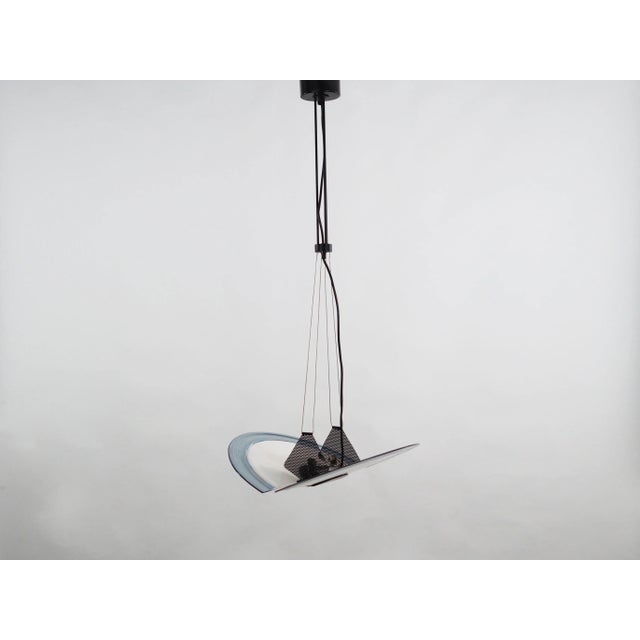 The lamp was made in the 1990s, Italian manufacture. Made of metal and glass. The unique construction is not only a design...