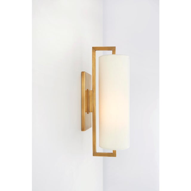 Bowen Medium Sconce in Hand-Rubbed Antique Brass with Linen Shade Designer: Ian K. Fowler Height: 16" Extension: 6.5"...