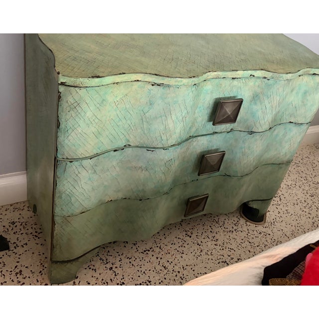 The image shows the Hooker Furniture Melange Turquoise Crackle Chest (Model 638-85016) , a serpentine -shaped accent chest...