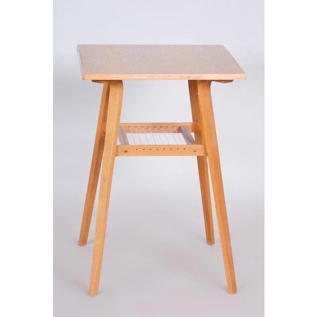 Designed by renowned Czech mid-century modern designer Ludvik Volak. It has been re-polished with polyutherane piano...