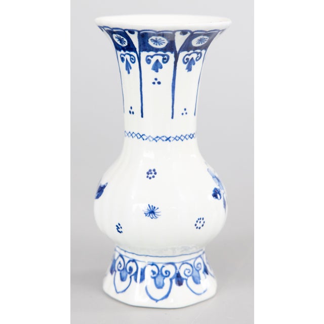 A lovely miniature Dutch Delft faience knobble vase by Royal Delft, dated 1964. Signed on reverse. This charming petite...