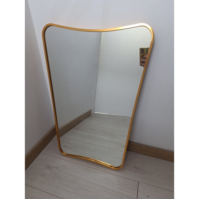 Mirror with Sinuous Brass Frame by Gio Ponti for Gubi, 1990s, in Very Good conditions. Designed 1990 to 1999 I have...