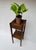 A handsome antique Arts & Crafts oak fern stand dating to the early 20th century. Built from beautifully grained oak with...