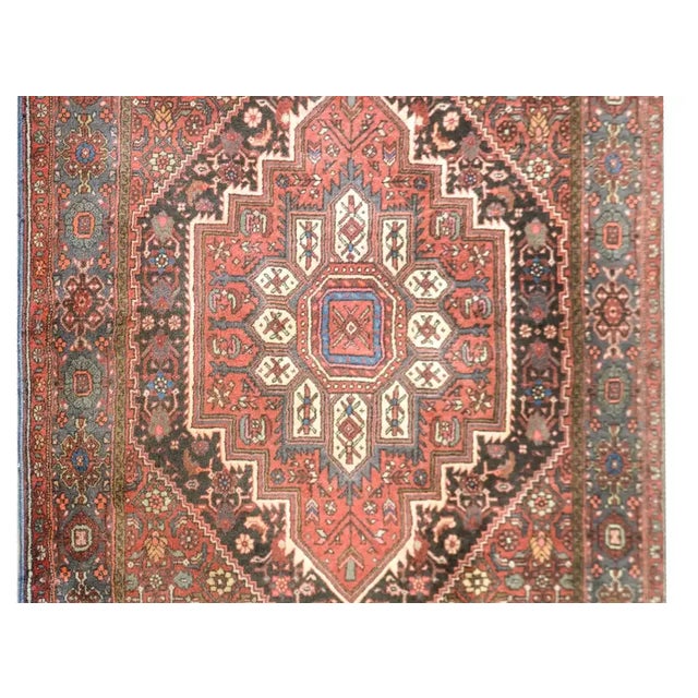 A beautiful vintage Persian Hamadan rug with a floral diamond medallion amidst a field of all-over flowers and scrolling...