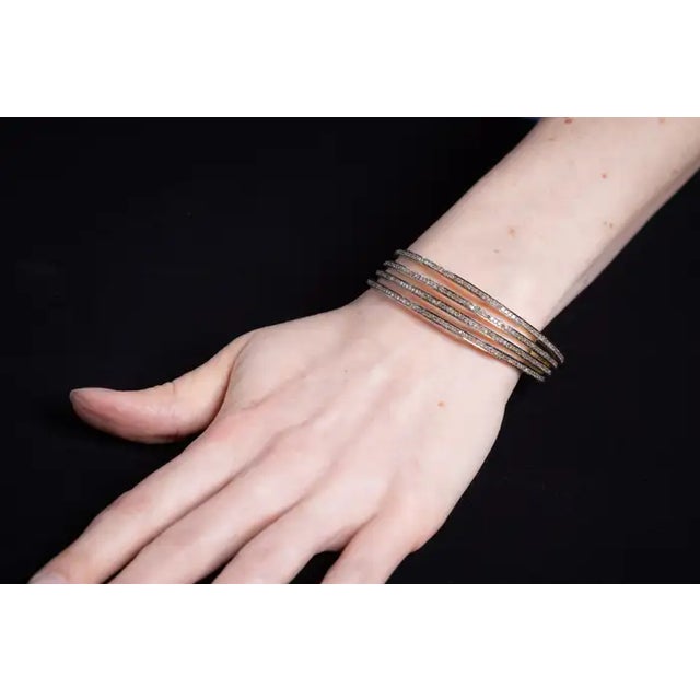 These pave`set diamond bangles can be worn alone, as a group or with other bracelets in your collection. They slip over...