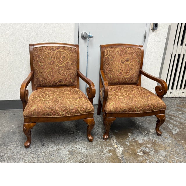 Design Plus Gallery presents a Pair of Diana Armchairs by Kensington Hill. Each chair has a rubberwood frame, scrolling...