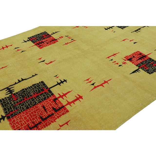 Made with hand-knotted wool circa 1960-1970, this 7x10 vintage rug from Turkey is believed to be the work of mid-century...
