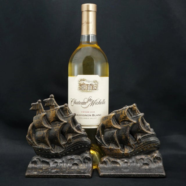 A heavy and useful pair of sailing ship bookends that are riding the waves with all sails out. The iron bookends are heavy...