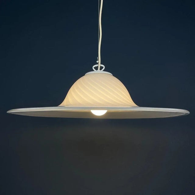Introducing this exquisite swirl retro Murano pendant lamp, crafted by Vetri Murano in Italy during the 1970s. Adorned...