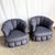 This striking pair of postmodern lounge chairs features sculptural clam shell silhouettes with deeply channel-tufted...