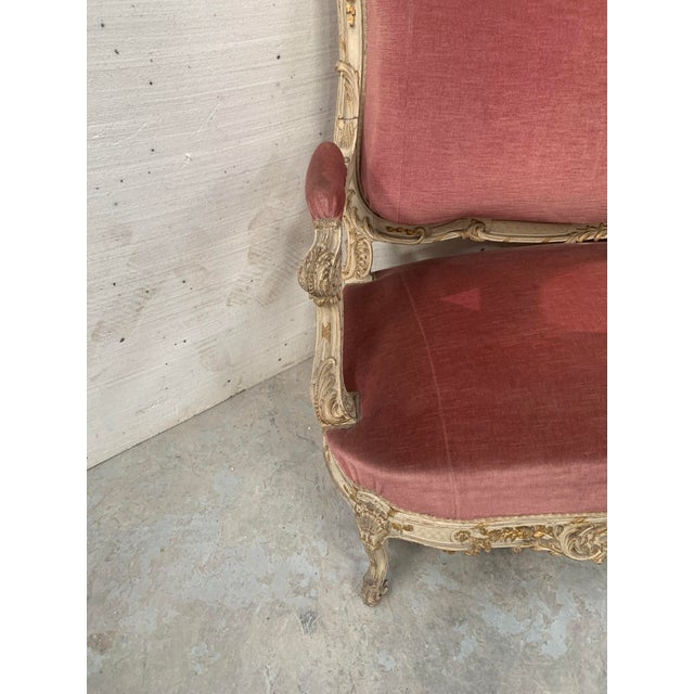 A louis xv style ceremonial bench in patinated and gilded beechwood. beautifully carved on the front and back. three...