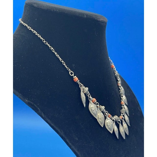 Delicate antique Middle Eastern Necklace. Charms are leaf shaped with a Repousse design, each are similar. Small bead...