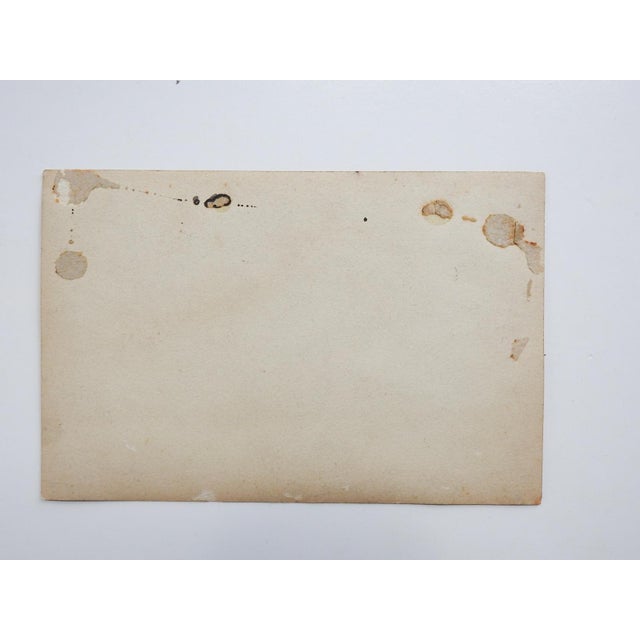 Early 20th century silver gelatin studio portrait photograph of a boy and girl. The boy is wearing a Boy Scout belt....