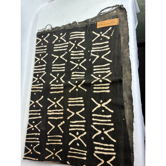 This charcoal brown Mud Cloth sports a natural, geometric design in ivory. The raw hem and rustic seaming are two unique...