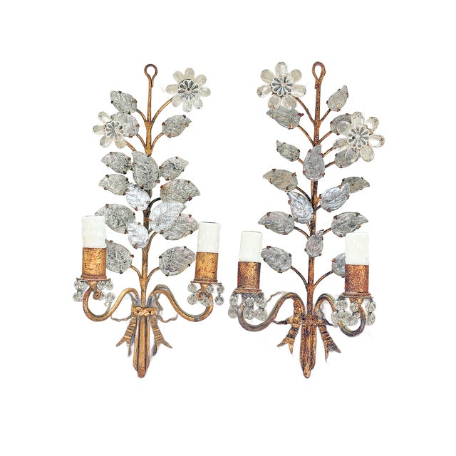 This is a beautiful pair of early 20th Century Maison Baguès wall sconces featuring gilt metal frames with stylized...