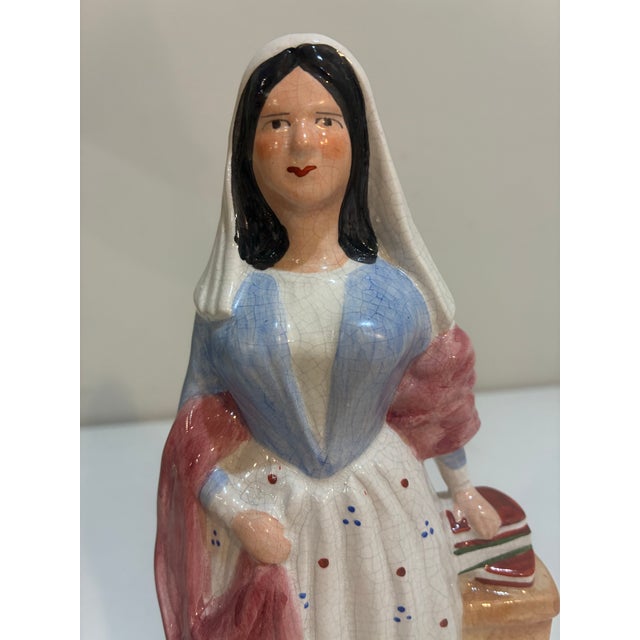 ENGLISH STAFFORDSHIRE HAND-PAINTED CERAMIC "MISS NIGHTINGALE" FIGURE, standing on an ovoid base with the famous English...