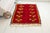 This is a vintage Turkish Oushak rug from the Mid 20th Century. The piece was hand-knotted.